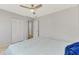 Spacious bedroom with ceiling fan, double bed and closet at 3460 Lullaby Rd, North Port, FL 34287