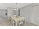 Bright dining room with white table and chairs at 3460 Lullaby Rd, North Port, FL 34287