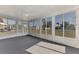 Sunroom with grey carpet, ceiling fan and view of backyard at 3460 Lullaby Rd, North Port, FL 34287