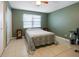 Spacious bedroom with double bed, nightstands, and built-in desk at 66 Boundary Blvd # 271, Rotonda West, FL 33947