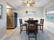 Bright dining area with a round table and four chairs, open to kitchen at 66 Boundary Blvd # 271, Rotonda West, FL 33947