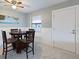 Dining area with table and four chairs, near living room at 66 Boundary Blvd # 271, Rotonda West, FL 33947