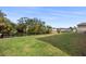 Large grassy backyard with canal access, offering waterfront living at 710 Albee W Rd, Nokomis, FL 34275