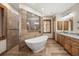 Luxurious bathroom with a freestanding tub and a walk-in shower at 710 Albee W Rd, Nokomis, FL 34275