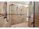 Large walk-in shower with dual shower heads and tile surround at 710 Albee W Rd, Nokomis, FL 34275