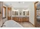 Elegant bathroom with double vanity, granite countertop, and soaking tub at 710 Albee W Rd, Nokomis, FL 34275