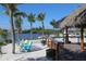 Relaxing beach bar with tiki hut and seating at 710 Albee W Rd, Nokomis, FL 34275