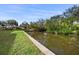 Peaceful canal view from the backyard, ideal for waterfront relaxation at 710 Albee W Rd, Nokomis, FL 34275