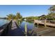 Wooden dock with boardwalk and gazebo at 710 Albee W Rd, Nokomis, FL 34275