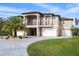 Two-story home with three-car garage and circular driveway at 710 Albee W Rd, Nokomis, FL 34275