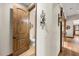 Hallway with barn door, wood flooring and powder room at 710 Albee W Rd, Nokomis, FL 34275