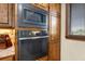 Built-in microwave and oven with sleek, stainless steel finish at 710 Albee W Rd, Nokomis, FL 34275