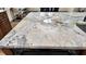 Close-up view of a kitchen island with stunning granite countertops at 710 Albee W Rd, Nokomis, FL 34275