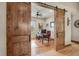 Home office with barn doors, wood floors and a desk at 710 Albee W Rd, Nokomis, FL 34275