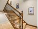 Elegant wooden staircase with wrought iron railing at 710 Albee W Rd, Nokomis, FL 34275