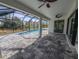 Screened pool and patio with pavers and ceiling fan at 7330 Printer St, Port Charlotte, FL 33981