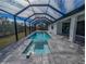 Screened pool and spa with paver deck at 7330 Printer St, Port Charlotte, FL 33981