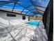 Screened pool and spa with paver deck at 7330 Printer St, Port Charlotte, FL 33981