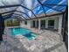 Screened pool and spa with paver deck at 7330 Printer St, Port Charlotte, FL 33981