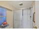 Clean bathroom features a shower with grab bars for accessibility at 735 Summersea Ct, Englewood, FL 34223