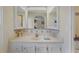 Bright bathroom boasts a vanity with mirror and a shower/tub combo at 735 Summersea Ct, Englewood, FL 34223