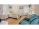 Light and airy bedroom with a comfy bed and seating area at 735 Summersea Ct, Englewood, FL 34223