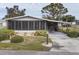 Single-story home with carport and landscaped yard at 735 Summersea Ct, Englewood, FL 34223