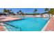 Refreshing community pool with plenty of lounge chairs at 735 Summersea Ct, Englewood, FL 34223