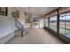 Bright screened porch with tiled floor, offering extra living space at 735 Summersea Ct, Englewood, FL 34223