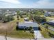 Aerial view of single-story home, detached garage, and large lot at 7379 Rosemont Dr, Englewood, FL 34224