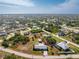 Aerial view of single-story home with spacious lot and surrounding houses at 7379 Rosemont Dr, Englewood, FL 34224