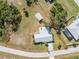 Aerial view of property showing house, detached garage, and large lot at 7379 Rosemont Dr, Englewood, FL 34224