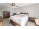 Bedroom with double bed and wood furniture at 7379 Rosemont Dr, Englewood, FL 34224