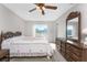 Bedroom with double bed, dresser and view at 7379 Rosemont Dr, Englewood, FL 34224