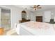 Bedroom with double bed, dresser, and ensuite bathroom at 7379 Rosemont Dr, Englewood, FL 34224