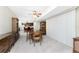 Bright dining room with table and chairs, view into kitchen at 7379 Rosemont Dr, Englewood, FL 34224