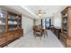 Formal dining room with wood furniture and window access at 7379 Rosemont Dr, Englewood, FL 34224