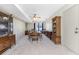 Dining room with wood furniture, carpeting, and access to back porch at 7379 Rosemont Dr, Englewood, FL 34224