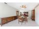 Bright dining room with table and chairs, view into kitchen at 7379 Rosemont Dr, Englewood, FL 34224