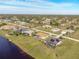 Aerial view highlighting the house's location and canal side lot at 738 Boundary Blvd, Rotonda West, FL 33947