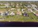 Aerial view showcasing the house's location, backyard, and pool at 738 Boundary Blvd, Rotonda West, FL 33947