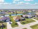 Aerial view of a house with a canal view in a residential area at 738 Boundary Blvd, Rotonda West, FL 33947