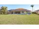 Backyard with a screened pool and patio area at 738 Boundary Blvd, Rotonda West, FL 33947