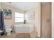 Relaxing bathroom featuring a corner soaking tub and a separate shower at 738 Boundary Blvd, Rotonda West, FL 33947