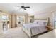 Spacious Primary bedroom with king-size bed and sliding doors leading to patio at 738 Boundary Blvd, Rotonda West, FL 33947