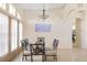 Bright dining room with glass table and four chairs, showcasing natural light at 738 Boundary Blvd, Rotonda West, FL 33947