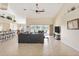 Spacious living room featuring a gray sectional sofa and access to a pool view at 738 Boundary Blvd, Rotonda West, FL 33947