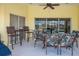 Spacious patio with table and chairs, perfect for outdoor dining at 738 Boundary Blvd, Rotonda West, FL 33947