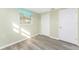 Bright bedroom with light flooring and double door closet at 850 E 2Nd St, Englewood, FL 34223