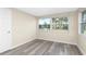 Bedroom with wood-look floors and backyard view at 850 E 2Nd St, Englewood, FL 34223